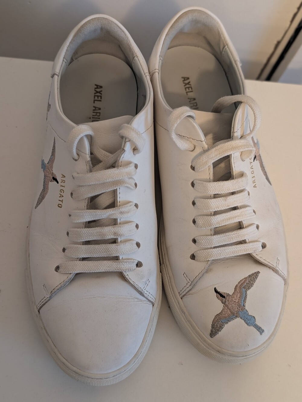 Axel Arigato White Sneakers with Embroidered Bird.
